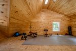 Upper story of the garage with some gym equipment